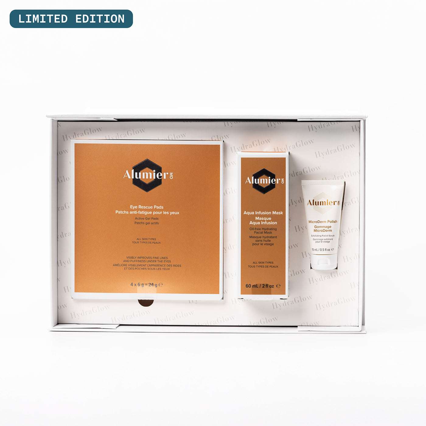 Alumier skincare product set with limited edition label on a white background