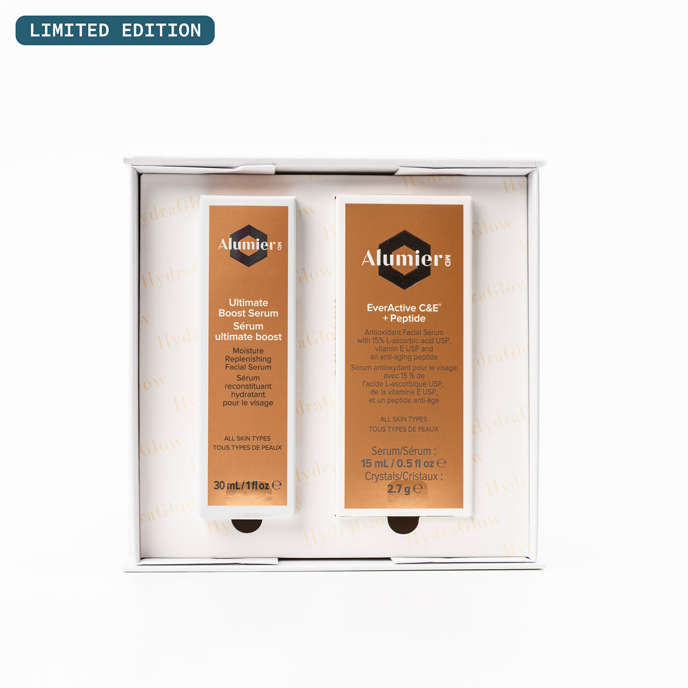 Alumier skincare set with two serums in an open box on a white background. Limited Edition is stamped on the top-left corner of the image.